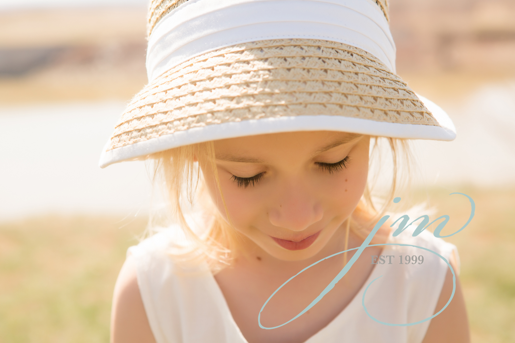 Denver family photos, Jenni Maroney Portrait Boutique, little girl with a hat 