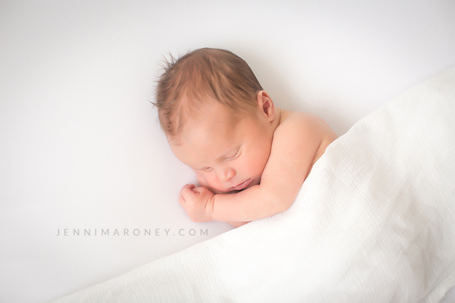 Denver newborn photographer and Boulder newborn photographer, Jenni Maroney shares an all white, neutral Boulder newborn session at her Boulder photography studio.