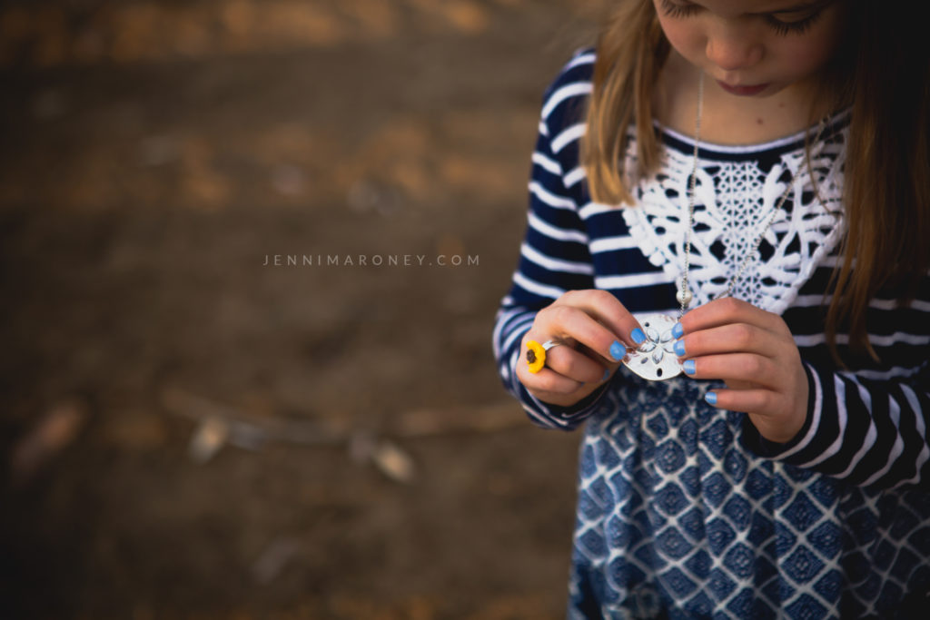 Little girl with golden hour light outdoor session with Boulder family photographer, Jenni Maroney.