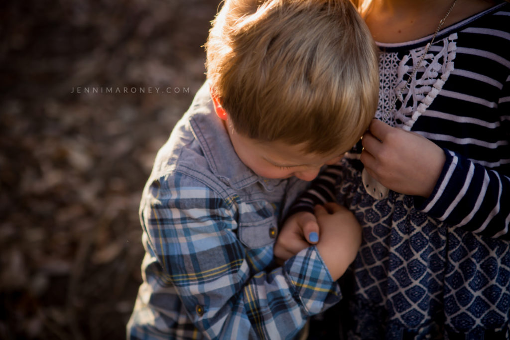 Little boy with golden hour light outdoor session with Boulder family photographer, Jenni Maroney.