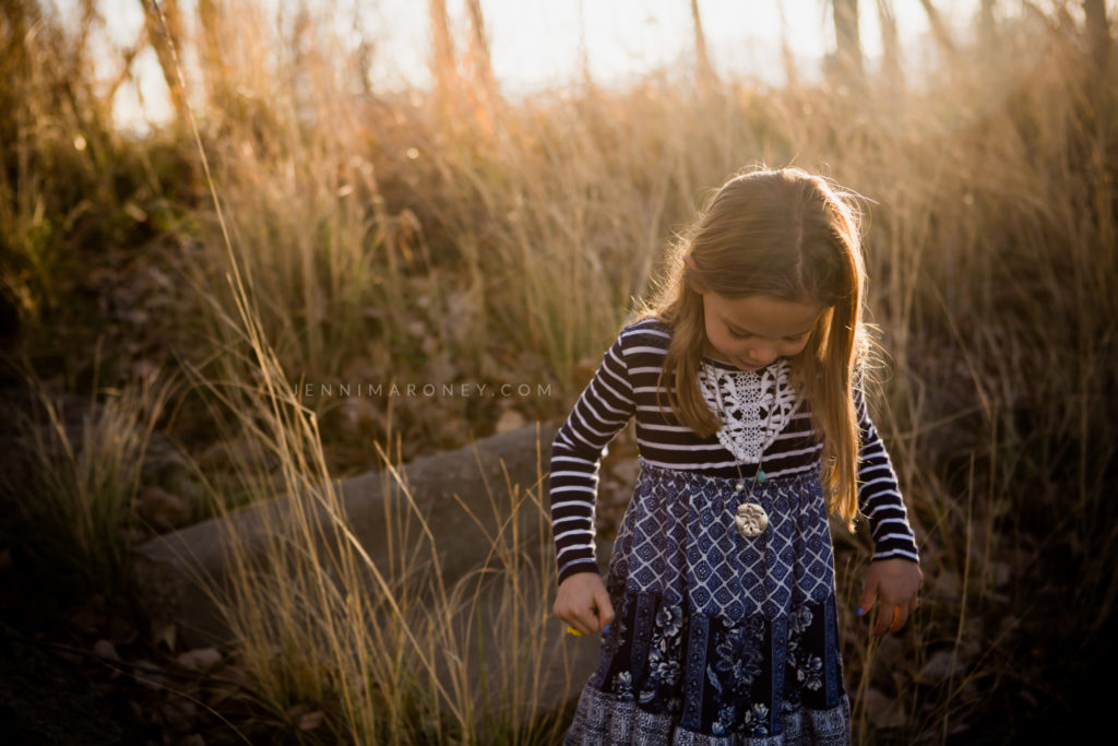 Little girl with golden hour light outdoor session with Boulder family photographer, Jenni Maroney.