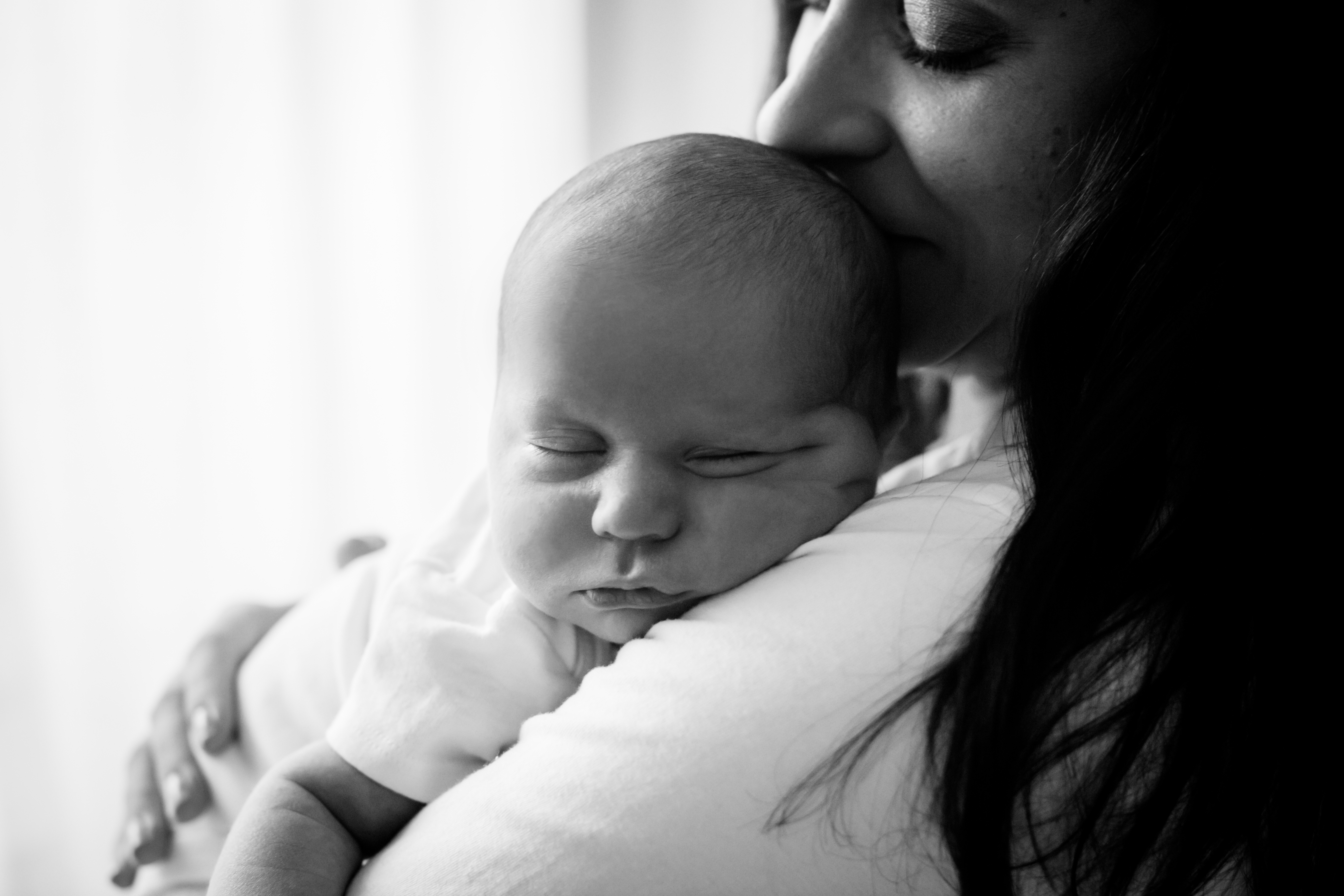 Black and white photo of mom and newborn by Boulder newborn photographer, Jenni Maroney.